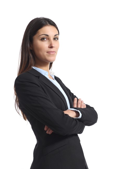 Confident dark-haired woman in suit looking over right shoulder